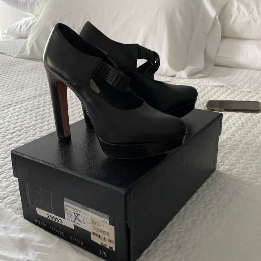 Beautiful TALL Prada shoes.  Worn a few times.